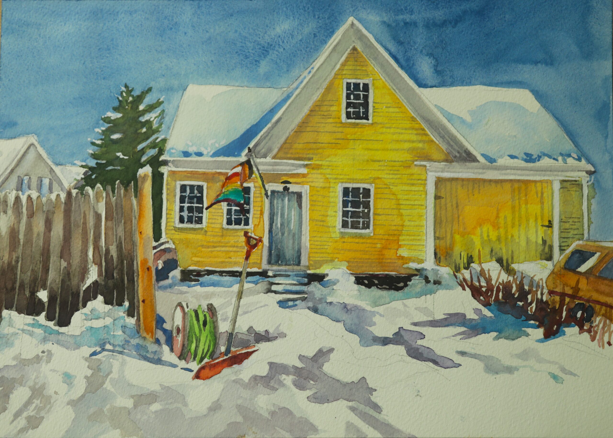 Yellow house in snow